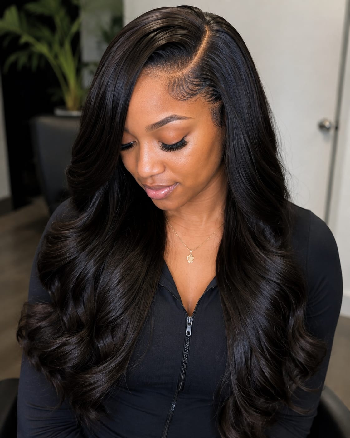 Client with a finished body wave install, photographed in the studio